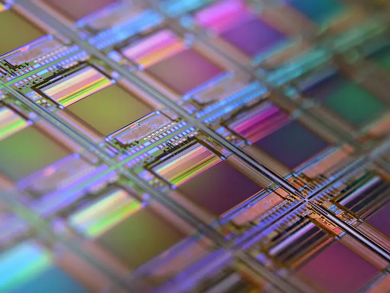 Iridescent dies on a silicon wafer