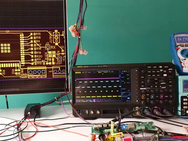 Oscilloscope and circuit layout on a lab bench