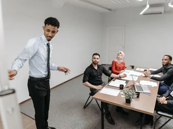 Trainer presenting to a small team