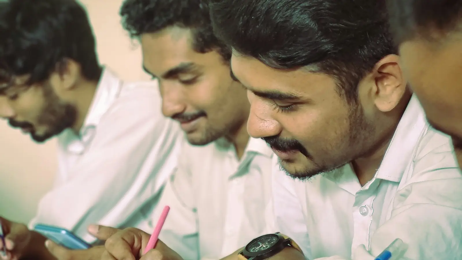 Engineering students taking notes together