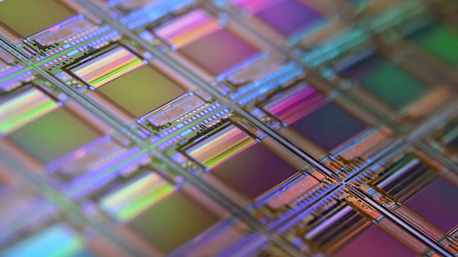 Iridescent dies on a silicon wafer